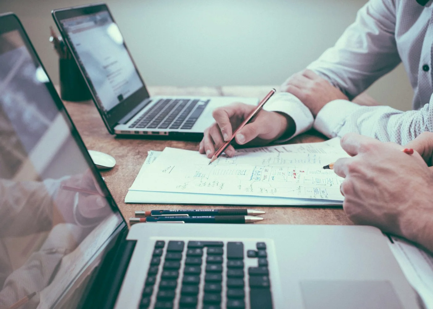 Business professionals reviewing documents and financial information